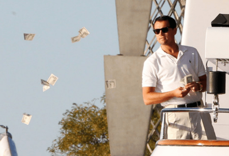Leonardo DiCaprio throwing prop bills from a yacht